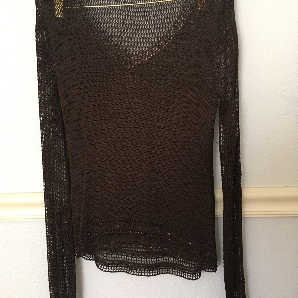 Open knit top with decorative details